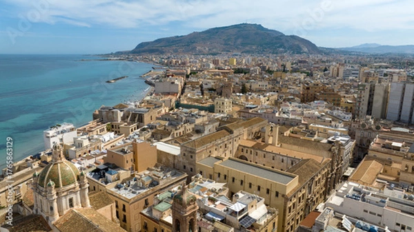 Fototapeta Aerial view of houses and buildings in the historic center of Trapani, Sicily, Italy. It is a beautiful city overlooking the Mediterranean Sea, with a mountain at the horizon.