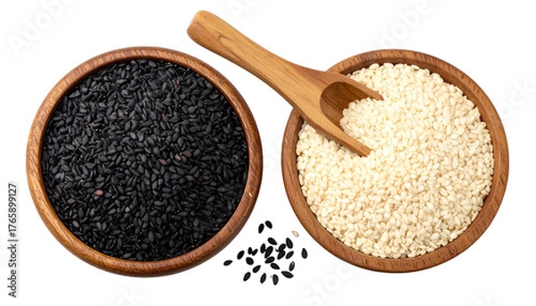 Obraz Two wooden bowls, one black, one white, seeds. Wooden scoop rests atop light-colored bowl