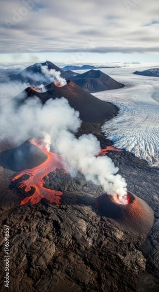 Fototapeta Aerial view of a volcanic eruption with glowing lava and smoke plumes