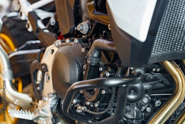 Fototapeta Detailed view of a motorcycle's engine showing intricate components and modern design features