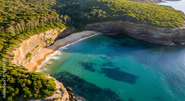 Obraz Aerial view of pristine beach cove with turquoise water and cliffs