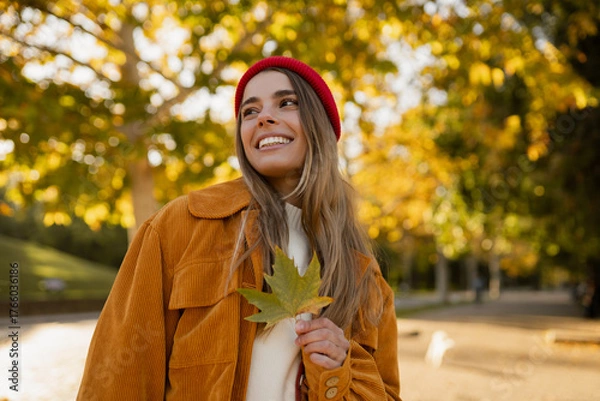 Obraz young attractive blond woman walking in autumn park, stylish , smiling