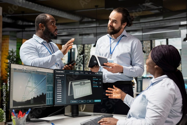 Fototapeta Team of engineers brainstorming upgrades for solar gadget to support green technology adoption. Teamworking colleagues test solar cells prototype, working on clean energy innovations