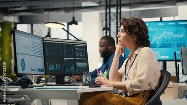 Obraz Business consultant focusing on global expansion strategy and planning resource allocation for organization, using digital tools to forecast insights and achieve corporate growth. Camera B.