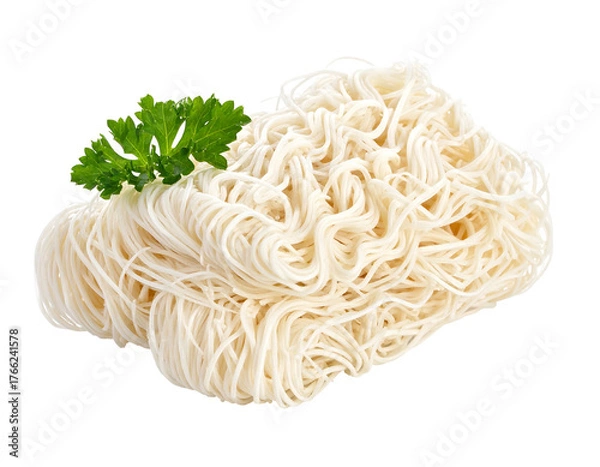 Fototapeta Pile of tangled, cooked noodles with a bright green parsley sprig on top, isolated on a black background