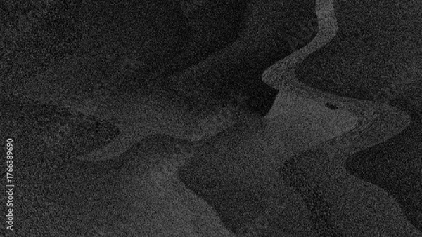 Fototapeta Volcanic stone surfaces, black sand, or abstract textures with dark gray and black gradients. Perfect as backdrop for designs that require a serious, modern, or industrial feel.