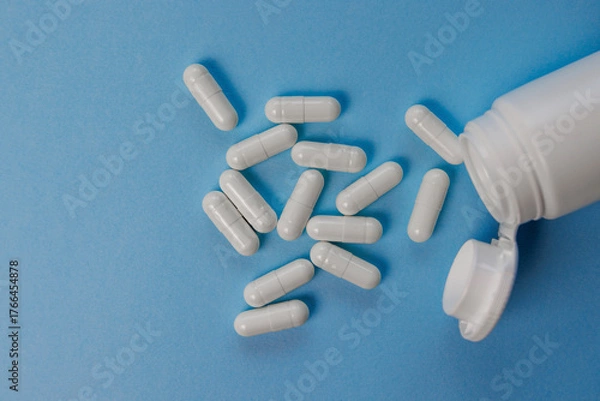 Fototapeta A pile of capsules on a surface. A concept in modern pharmacology.
