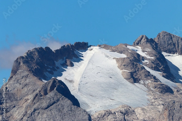 Fototapeta Aerial view of Marmolada Glacier in the Dolomites, highlighting snow-covered peaks and deep crevasses