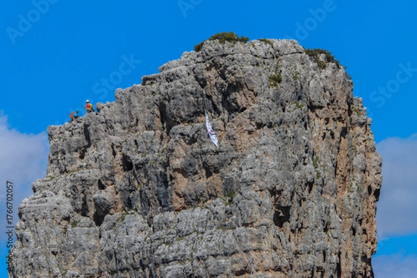 Fototapeta Brave climbers reaching the summit of one of the Cinque Tori