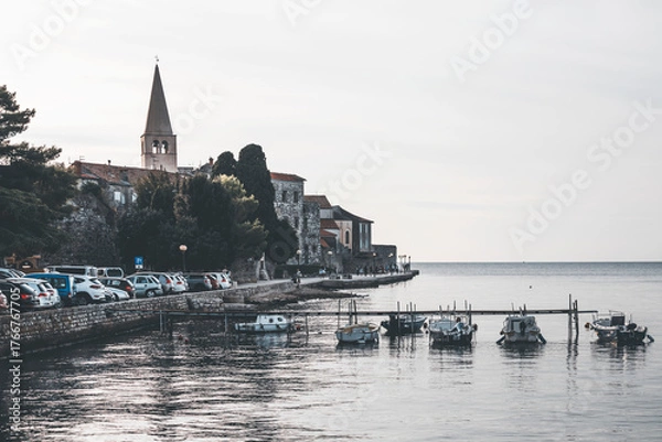 Fototapeta view of the old town of porec in istria, croatia, by the sea and some small boats in the water