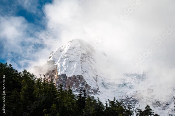 Fototapeta Snow capped mountains in the mist of the Qinghai Tibet Plateau