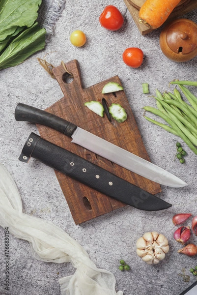 Fototapeta photo of a kitchen knife specifically for cutting vegetables and fruit, mirror and satin knife material