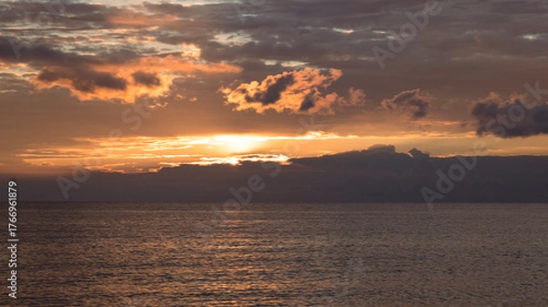 Fototapeta Dawn with dramatic clouds over the Aegean Sea