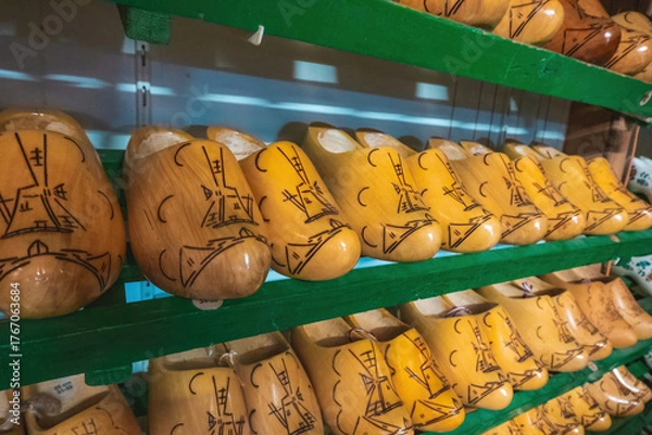 Fototapeta Classic wooden clogs in a display cabinet in an old factory in the Netherlands