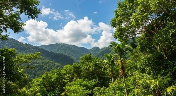 Obraz Lush Green Mountain Landscape with Tropical Trees and Cloudy Sky.