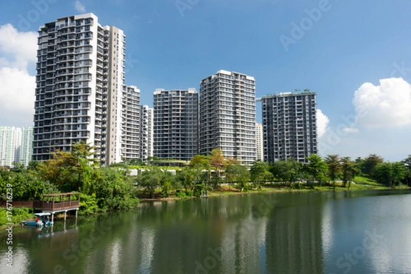 Fototapeta Lanscape view of condomium with trees near river