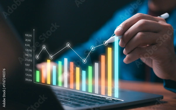 Fototapeta Professional businessman analyzing digital business data on a laptop, illustrating upward growth, success, and strategic financial planning through colorful statistical charts and technology.