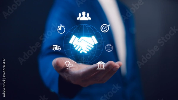 Fototapeta Global digital business handshake concept. A professional holds icons representing worldwide partnership, speed, logistics, teamwork, and integrated solutions for corporate success.