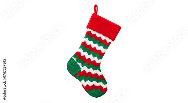 Fototapeta Festive christmas stocking with red cuff and chevron pattern in green red and white against a perfect for holiday decorations and gifts this season