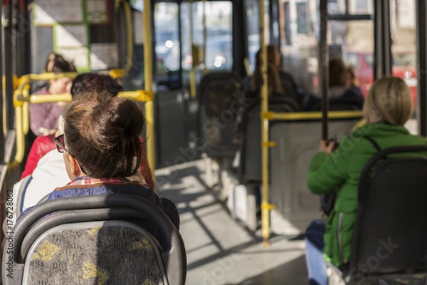 Obraz Passengers go to the bus around the city