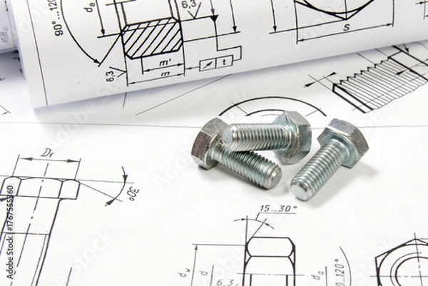 Obraz Printed engineering drawings and metal bolts. 