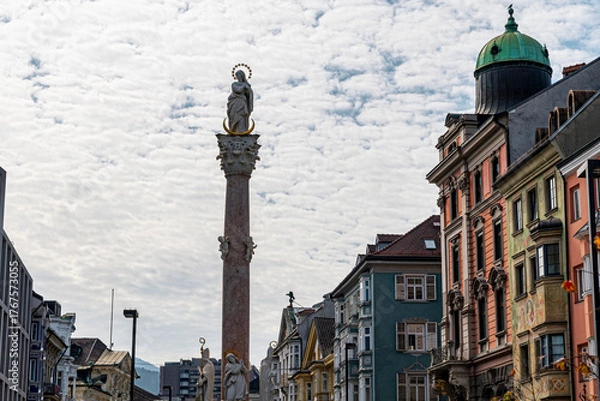 Fototapeta Innsbruck Austria Saint Anne’s Column with Historic Baroque Buildings and Cloudy Sky Cityscape