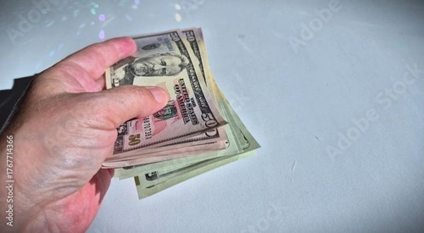 Fototapeta American or US dollars in form of a bunch of fifty and twenty dollar bills - money in the USA