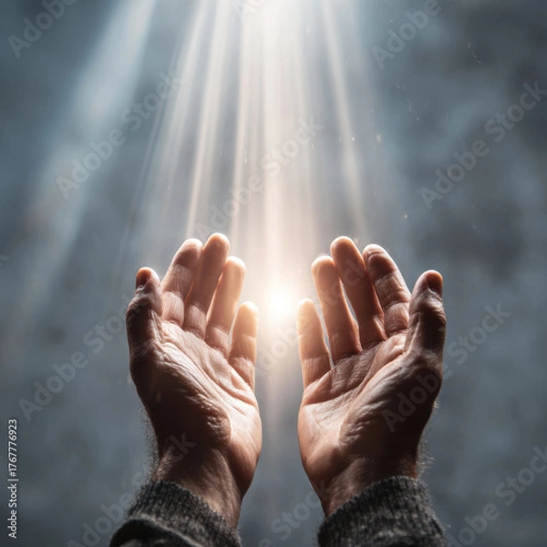 Obraz Hands reaching upward with light beams shining down, symbolizing hope and optimism