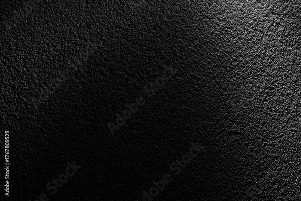 Obraz ざらざらした黒い土壁に斜光が当たる重厚なテクスチャー