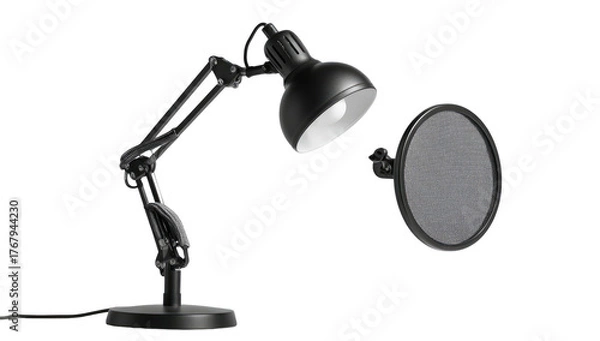 Fototapeta Black desk lamp with a pop filter. Studio lighting highlights the objects on a dark background