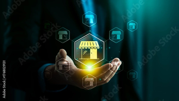 Fototapeta Franchise business model with businessman hand holding retail store icon, network expansion, brand growth, partnership opportunity, small business development, marketing strategy, franchise success