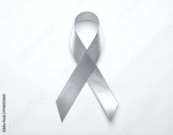 Fototapeta A shiny, silver ribbon symbol against a plain white background