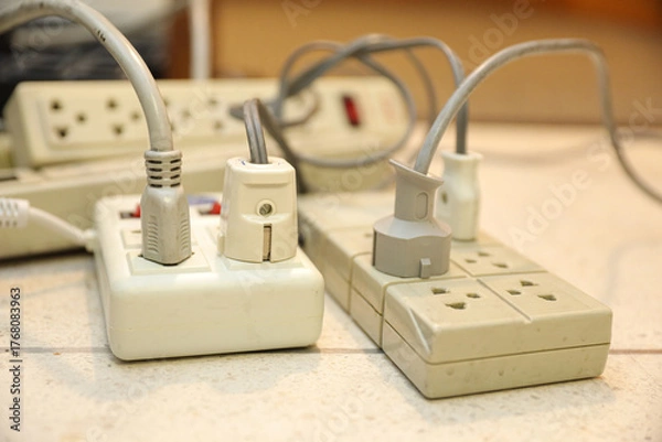 Fototapeta Old electrical extension cords plug is broken case damage and danger or connector voltage power burnt overload