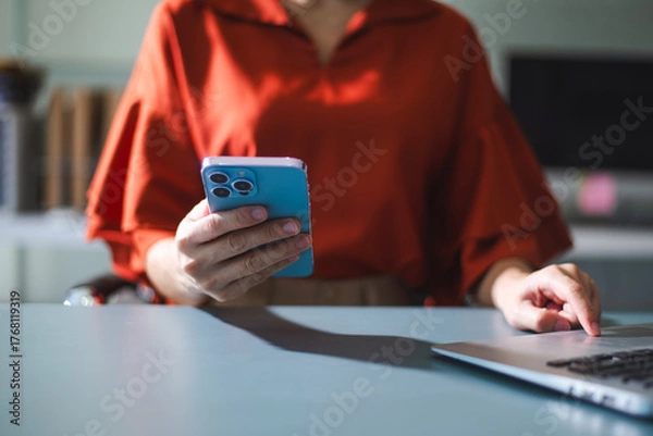 Fototapeta Businesswoman s hands typing on laptop keyboard in morning light computer, typing, online