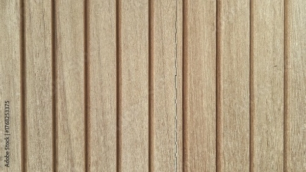 Fototapeta Detailed texture of light brown natural wood slats with deep vertical grooves and wood grain.
