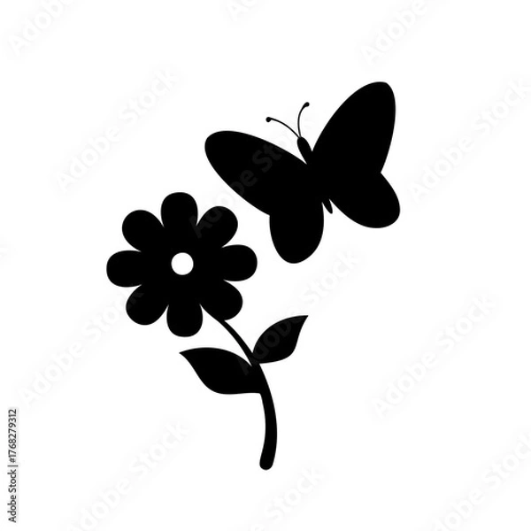 Fototapeta Simple black silhouette of a butterfly gracefully approaching a flower blossom