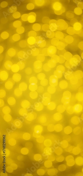 Fototapeta Abstract image of yellow-gold swirled bokeh background. Vertical 19:9 format.