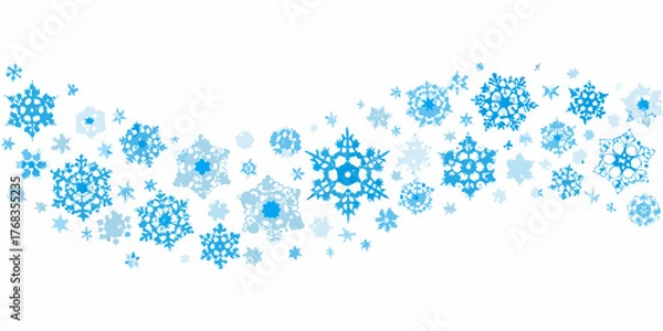 Fototapeta Abstract pattern of blue snowflakes scattered across a white background
