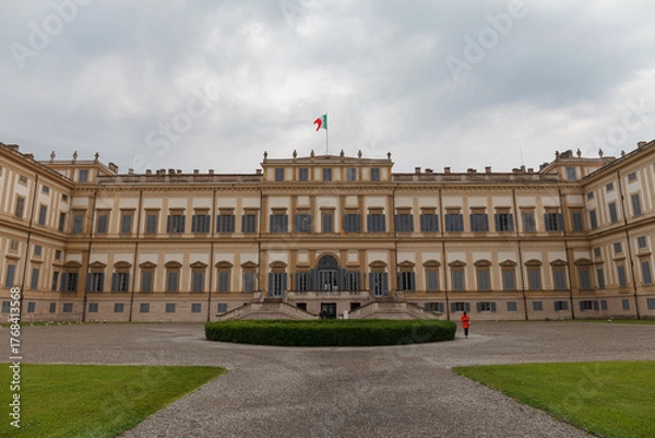 Fototapeta Monza, Italy - May 29, 2024: Royal Palace (Villa Reale), 18th century, facade under a cloudy sky in a spring afternoon