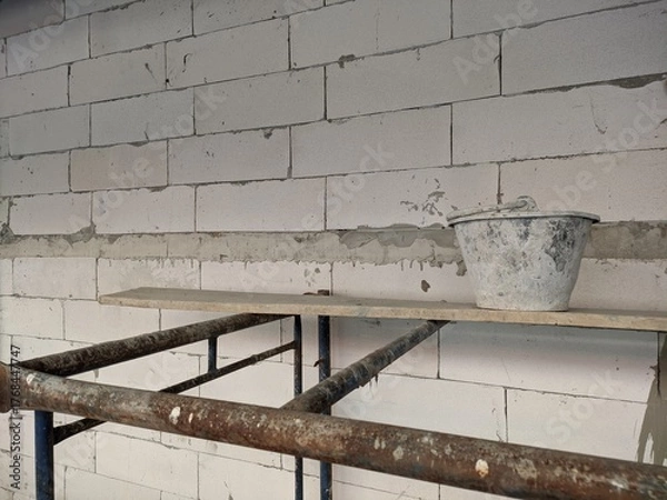 Fototapeta construction autoclaved aerated concrete wall with rusted scaffold