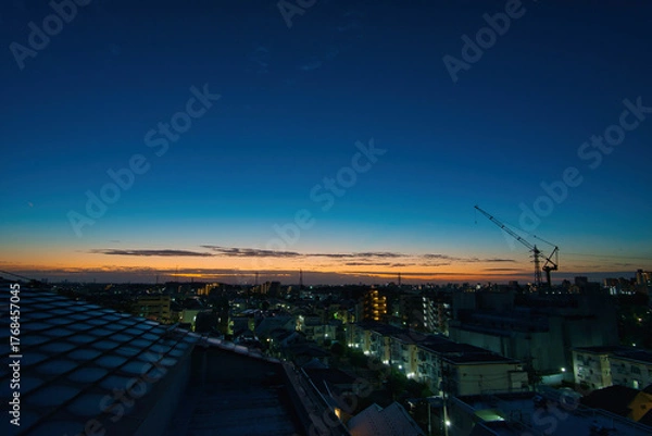 Fototapeta 朝日　朝焼け　都会の朝日