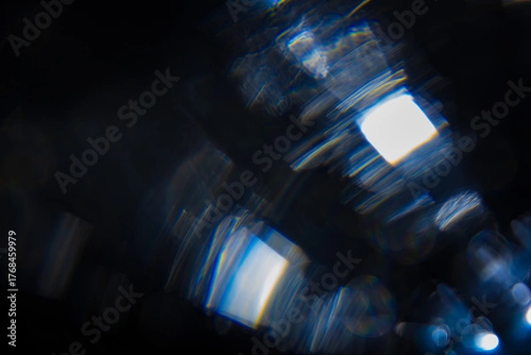 Obraz Glass reflections on the lens, spectrum colors, rainbows, bokeh in the dark, background image, optical effect