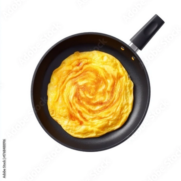 Fototapeta Delicately Cooked Yellow Omelette in Black Frying Pan on White Background