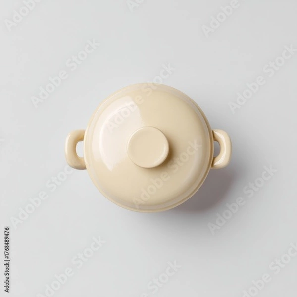 Fototapeta Minimalist Cream Soup Pot with Lid on a Soft Gray Background for Kitchen Decor and Culinary Use