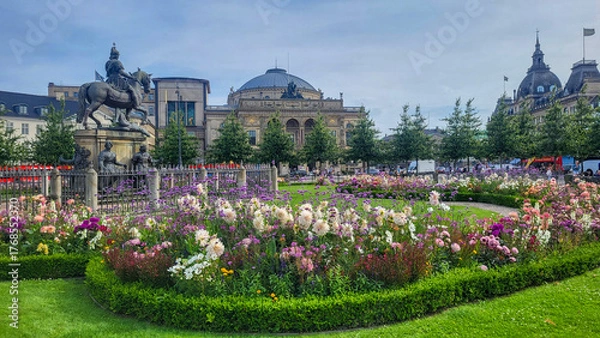 Fototapeta 07 August, 2024, Copenhagen city center, Denmark Summer day scenic canal with boats and tourists, cyclists riding along colorful buildings and waterfront, vibrant urban atmosphere in European capital