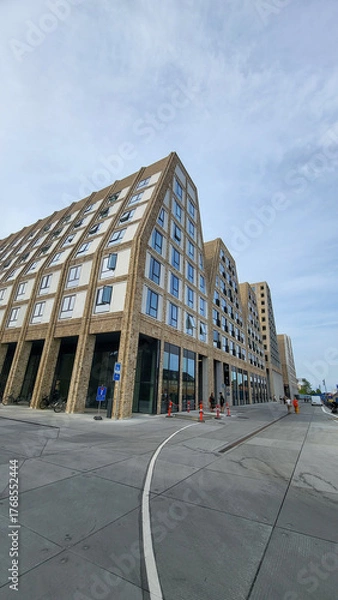 Fototapeta 07 August, 2024, Copenhagen city center, Denmark Summer day scenic canal with boats and tourists, cyclists riding along colorful buildings and waterfront, vibrant urban atmosphere in European capital