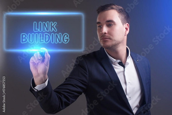 Fototapeta The concept of business, technology, the Internet and the network. Young businessman showing inscription: Link building