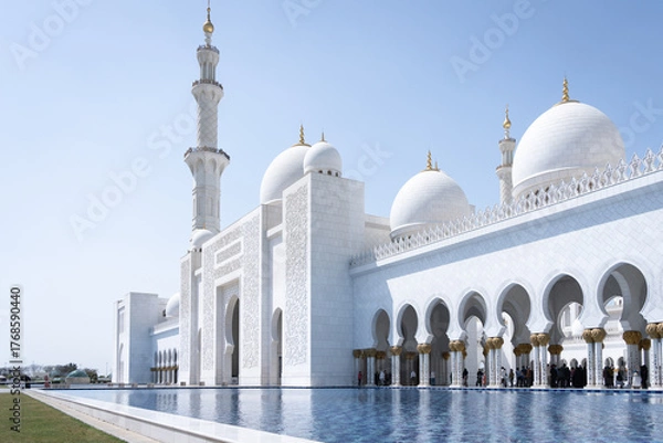 Fototapeta Front view of beautiful white marble mosque with minaret, United Arab Emirates