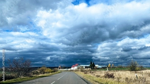 Obraz storm clouds over the road