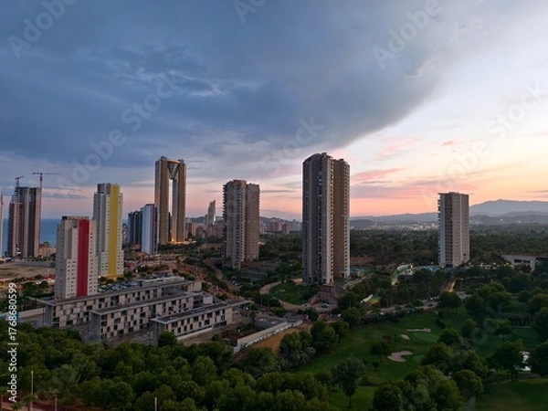 Fototapeta urban skyline reaches greenbelt boundary, city skyline interfaces with lush greenbelt edge